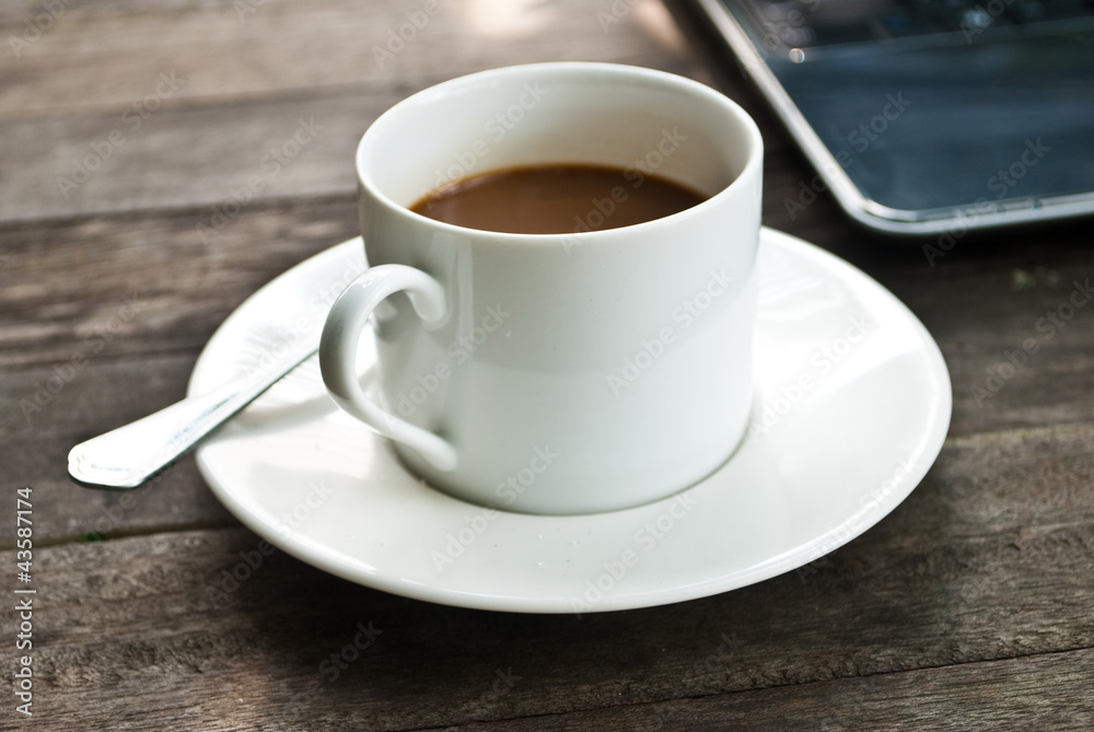 Coffee cup and laptop for business.