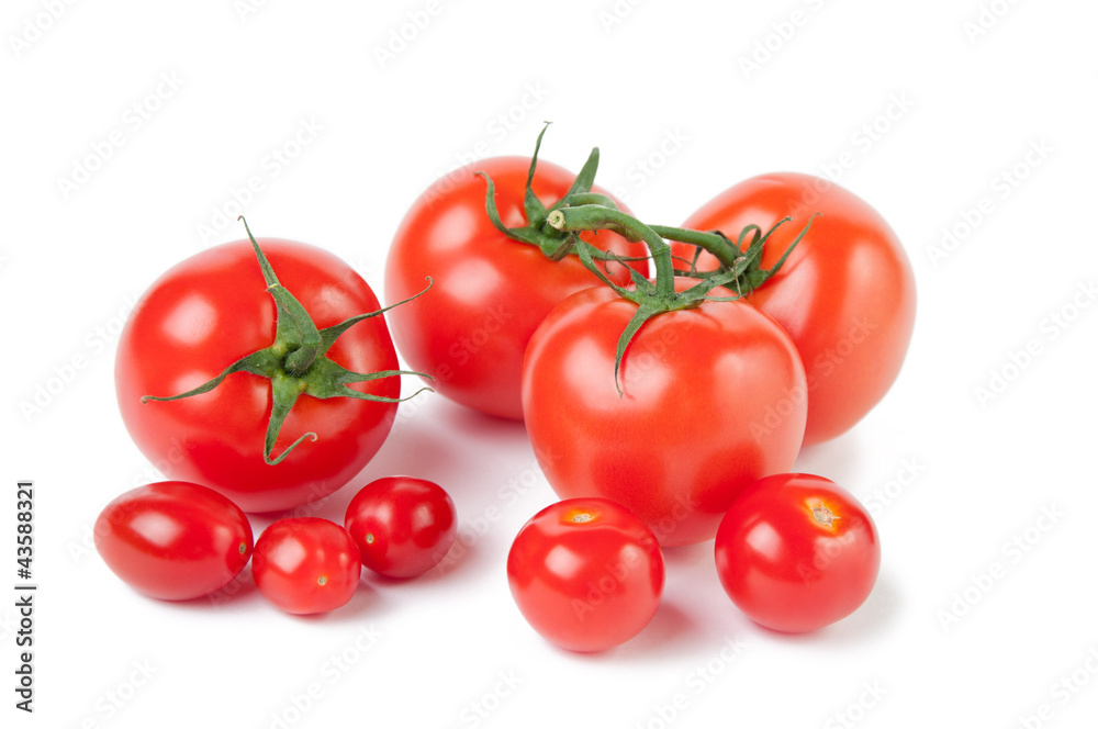 Variety of ripe tomatoes, isolated over white background