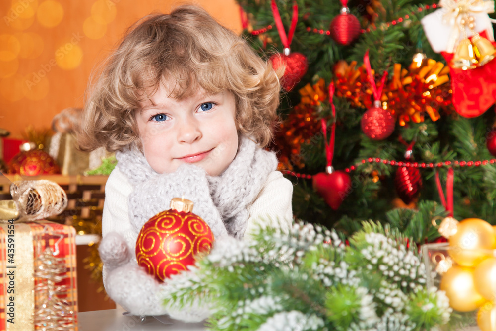 Happy child holding ball