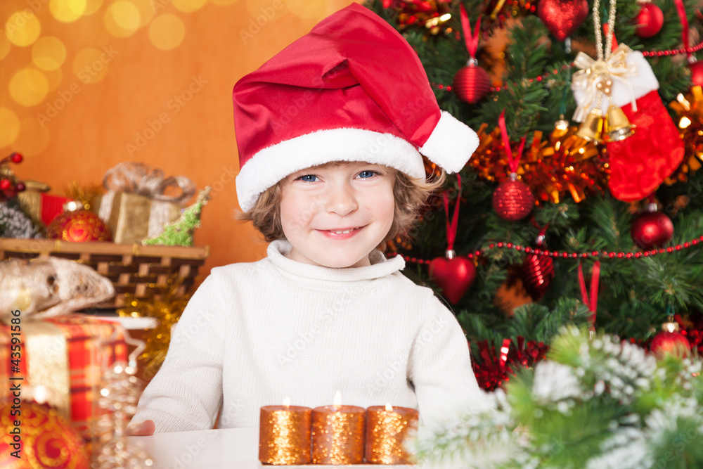 Happy smiling child in Santa`s hat Happy smiling child in Santa`s hat