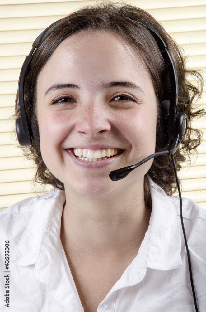 friendly staff member during a telephone conversation friendly staff member during a telephone conversation