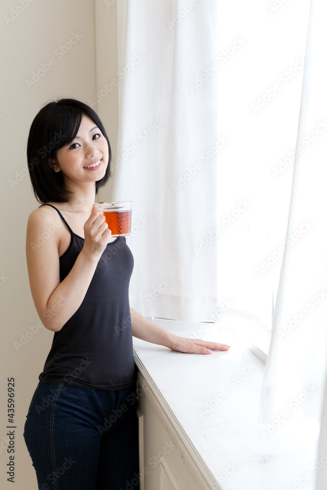 a young asian woman relaxing in morning a young asian woman relaxing in morning