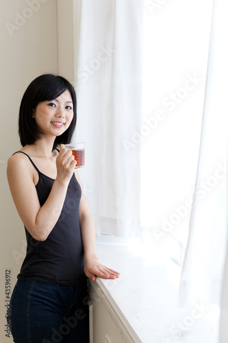 a young asian woman relaxing in morning