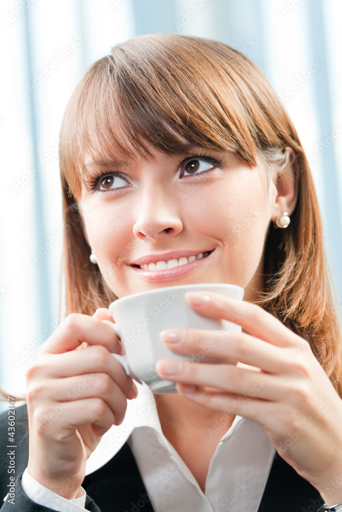 Cheerful smiling business woman with coffee Cheerful smiling business woman with coffee