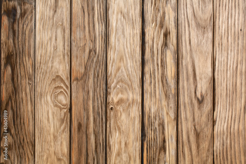 Planks of wood showing the grain patterns and knots in texture