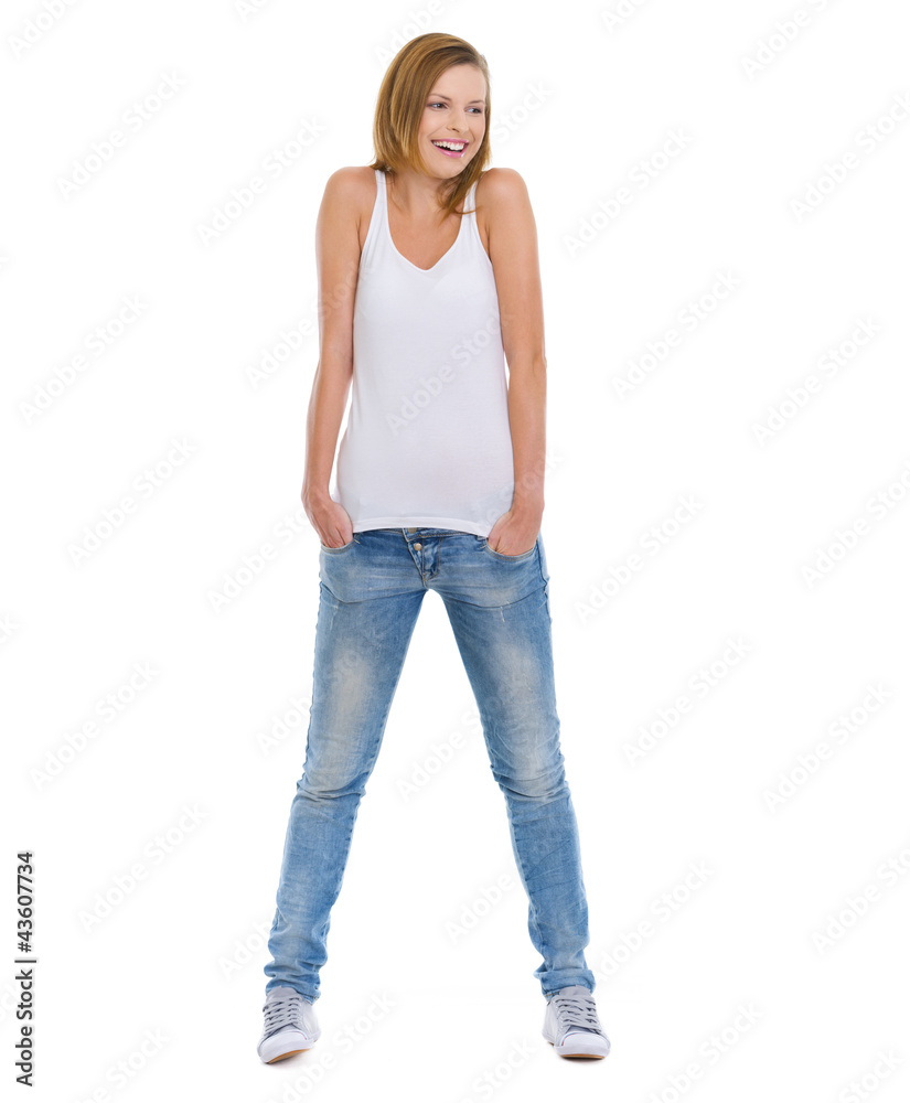 Full length portrait of smiling teenage girl looking on copy spa Full length portrait of smiling teenage girl looking on copy spa