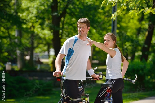 Happy couple riding bicycle outdoors © .shock