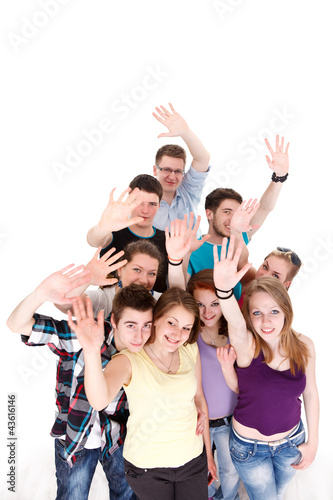 Group of smiling friends waving their arms