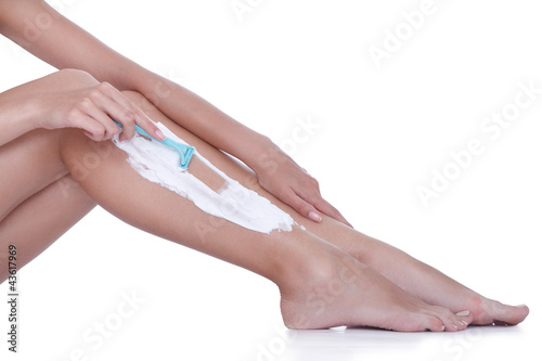 shaving with razor on the female legs