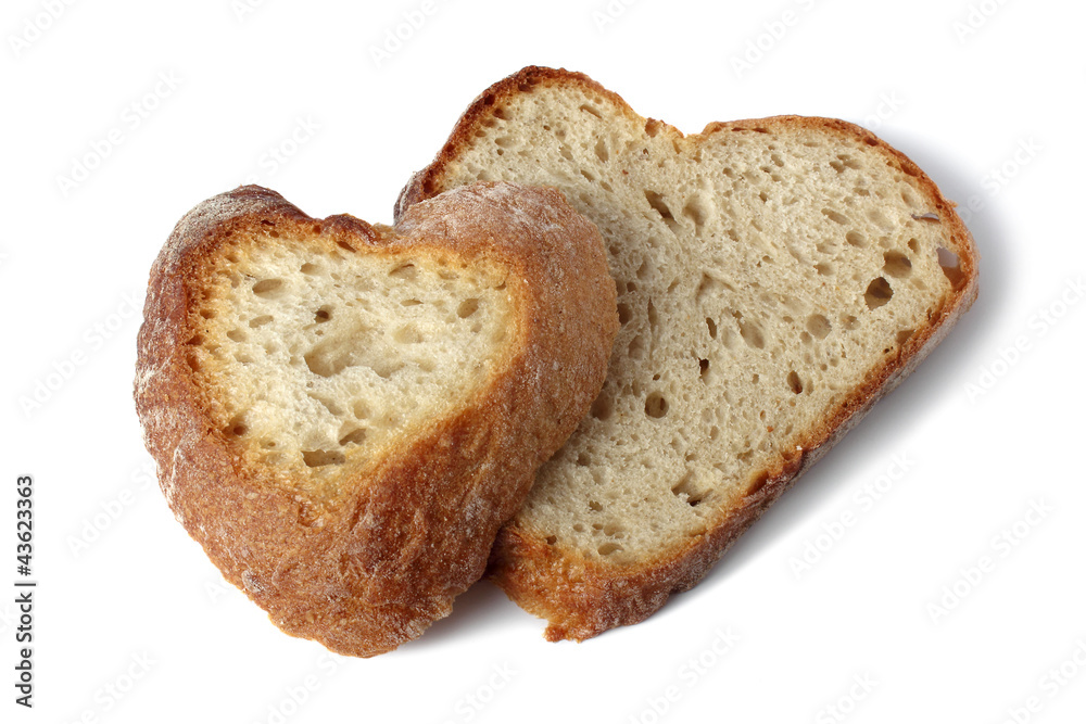 two slices of heart shaped bread isolated on white two slices of heart shaped bread isolated on white