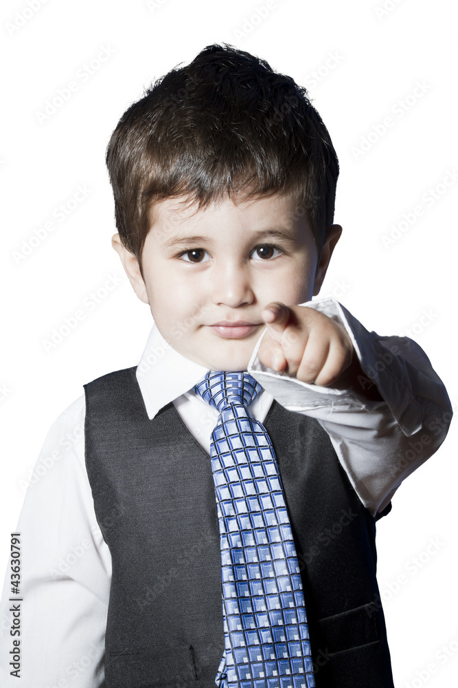 A small boy in the studio, dressed up in a suit and pretending t A small boy in the studio, dressed up in a suit and pretending t