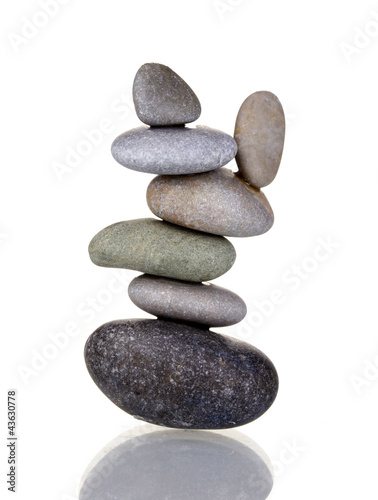 Stack of balanced stones isolated on white