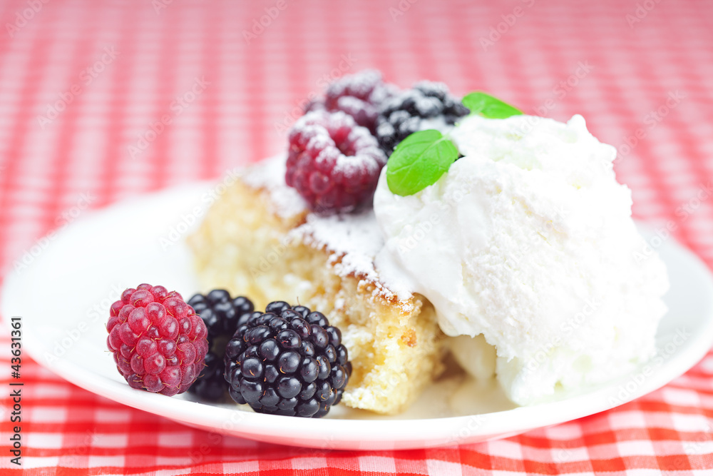cake with icing,icecream, raspberry, blackberry and mint on a pl cake with icing,icecream, raspberry, blackberry and mint on a pl