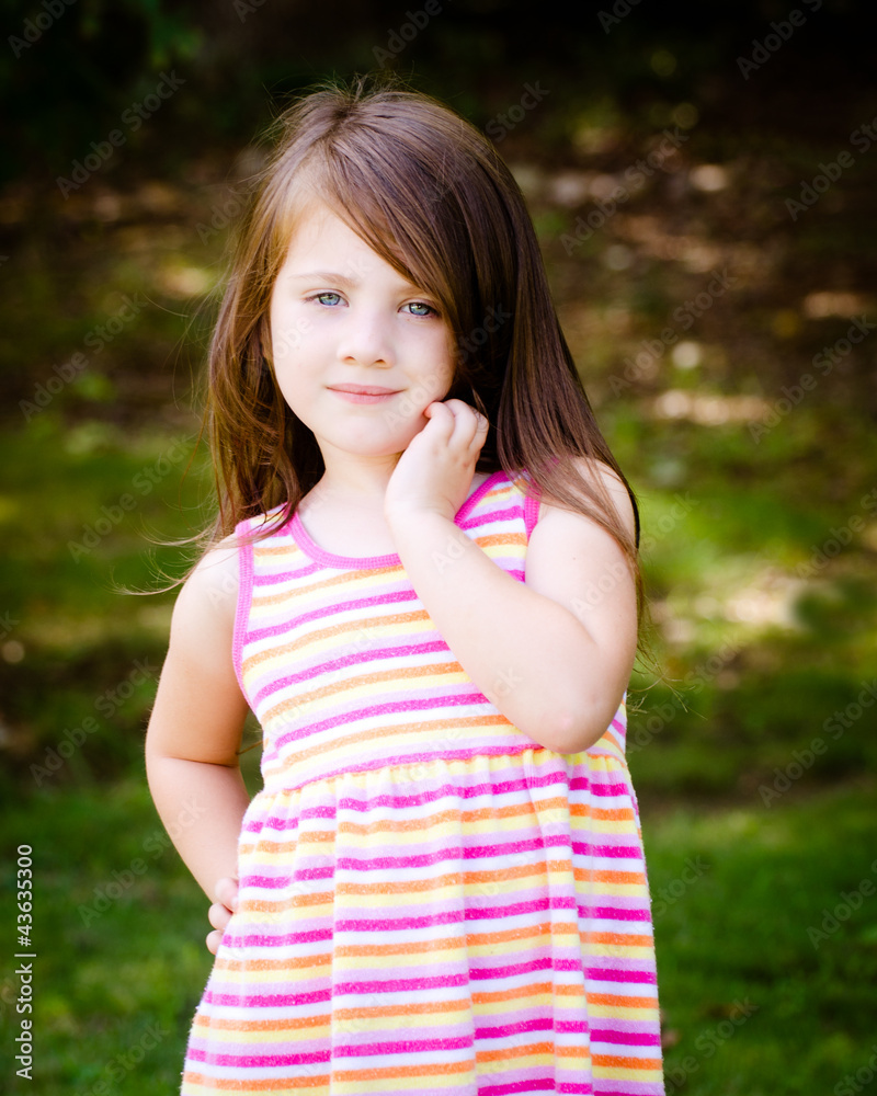 Outdoor portrait of cute young girl in park Stock Photo