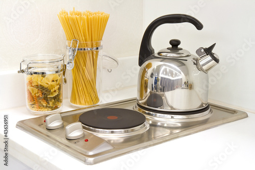Modern kitchen. Steel pot and pan on the induction cooker