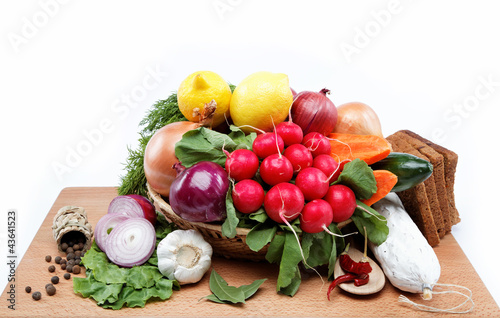 Healthy food. Fresh vegetables and fruits on a wooden board.