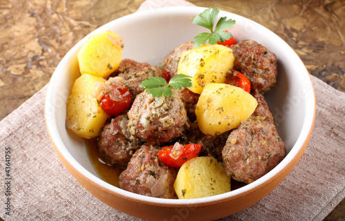 Meatballs with tomato sauce with potatoes in broth photo