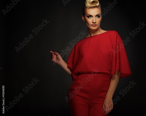 Fashionable woman in red with creative hairstyle