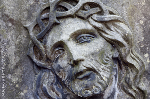 Closeup of Jesus Christ on old grunge grave