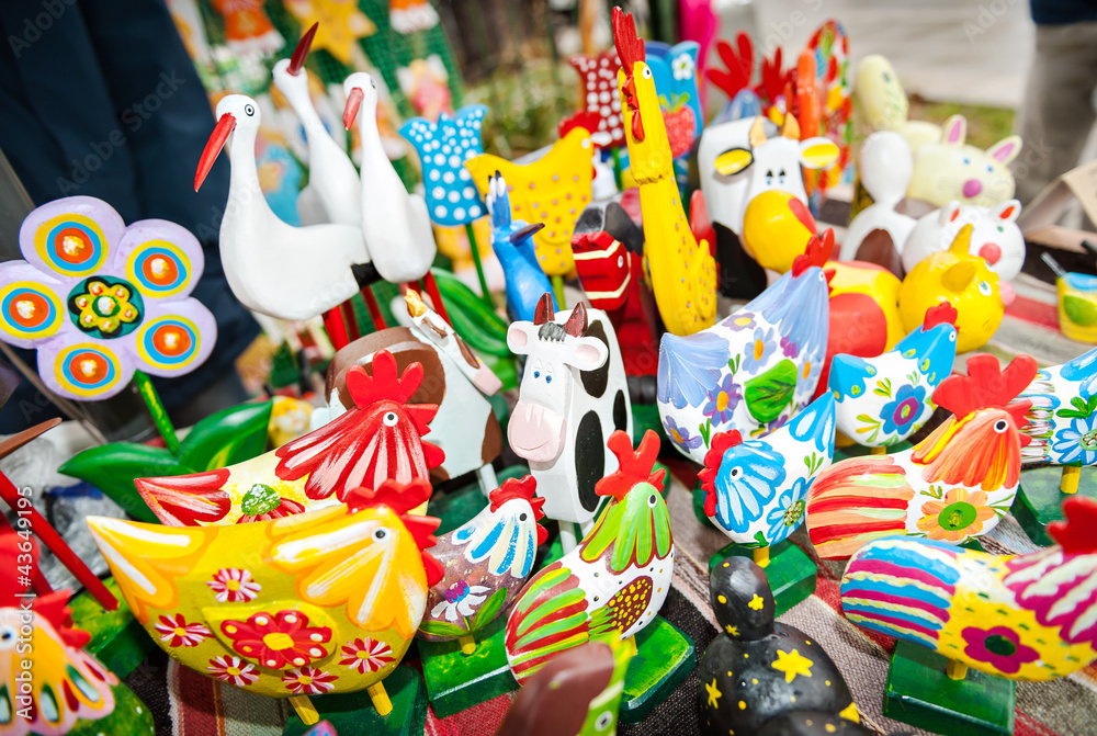 Traditional colorful wooden toy animals in the bazaar