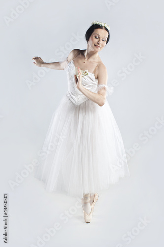 Beautiful ballerina in a white dress