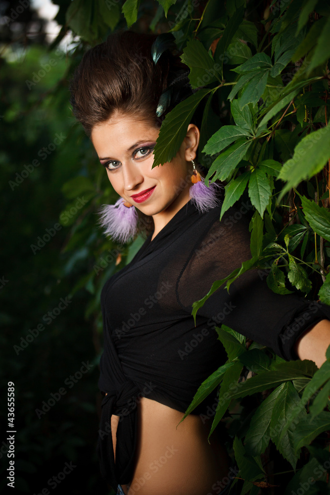 Fashion portrait of young sensual woman in forest Fashion portrait of young sensual woman in forest