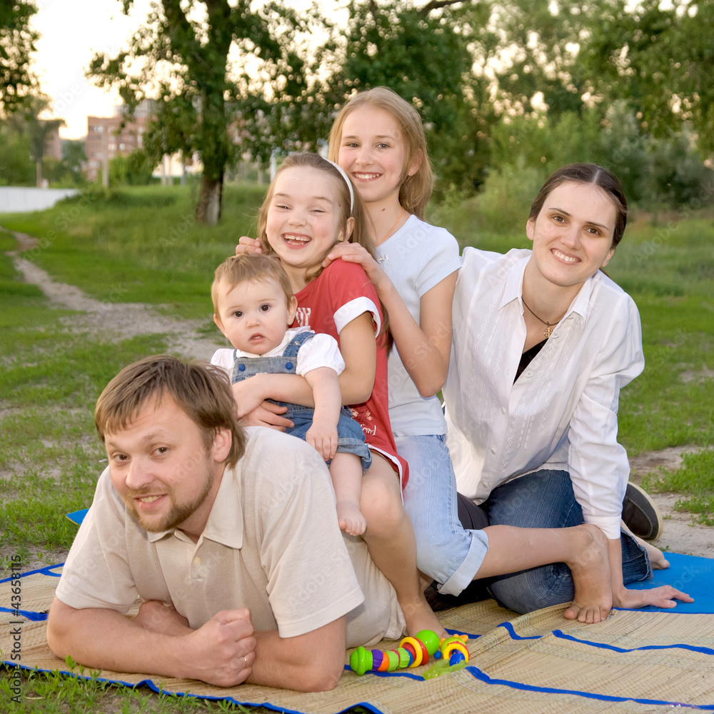 Big family - smiling father, mother and three daughters Big family - smiling father, mother and three daughters