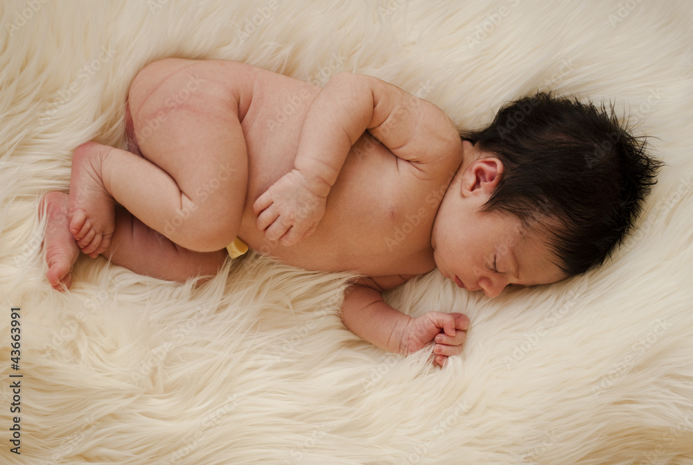 Little newborn dreaming on a hair carpet Little newborn dreaming on a hair carpet