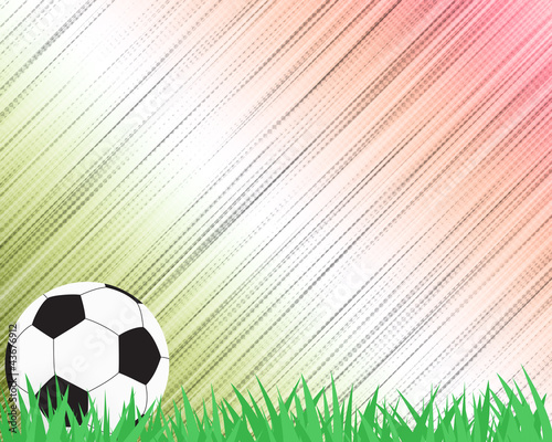 Football soccer on grass and abstract background