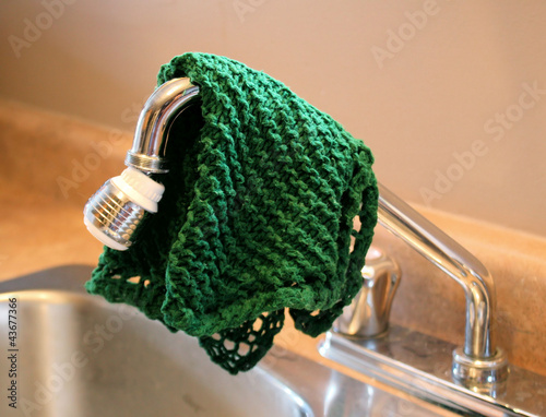 Dish Cloth Hanging Over Kitchen Sink