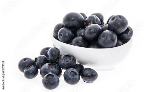 Blueberries in a bowl isolated on white
