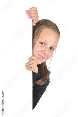 Teenage girl looks around the corner (isolated on white)