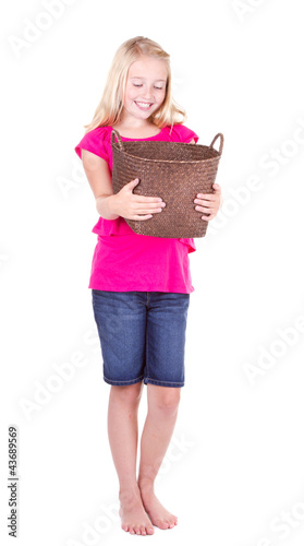 Girl looking down into empty basket