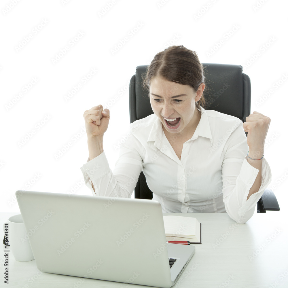young brunette business woman is happy behind her laptop young brunette business woman is happy behind her laptop