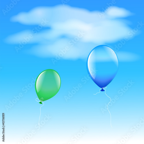 Two balloons flying in the sky