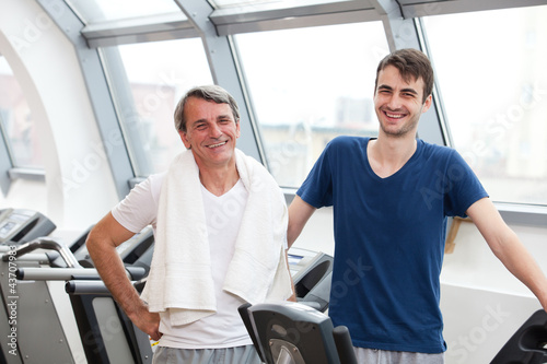 gym training, young man and his father