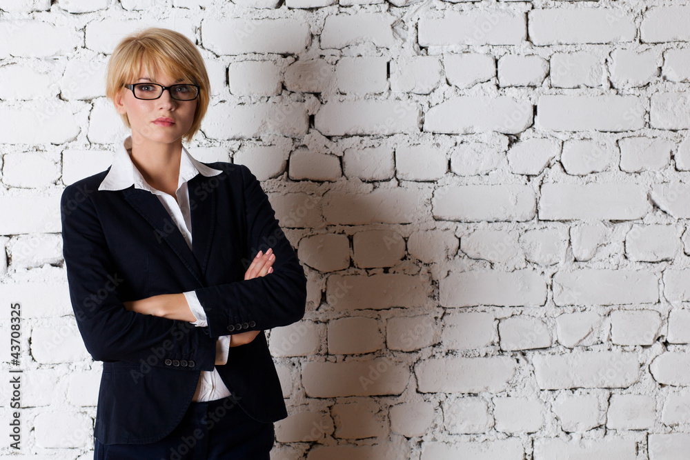 Beautiful blonde young businesswoman. Studio shot