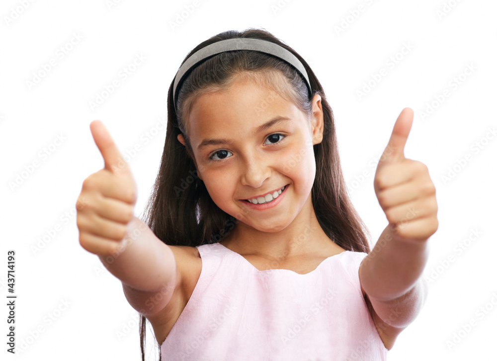 Portrait of young girl showing a thumbs up