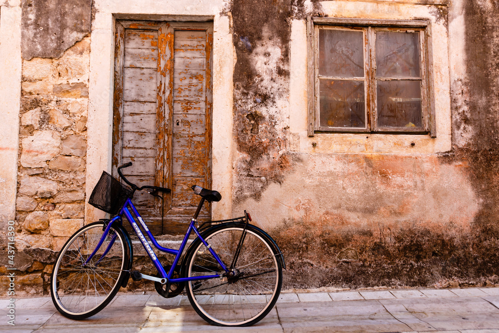 Blue Bicycle at the House Door in the Town of Skradin in Croatia