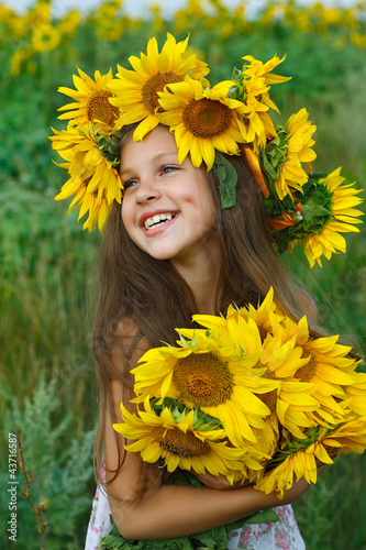 A little girl is in the field photo