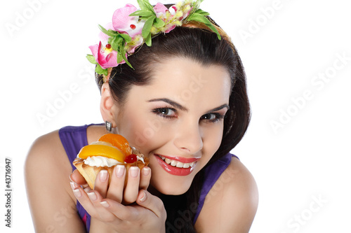 young  beautiful brunette with fruit cake