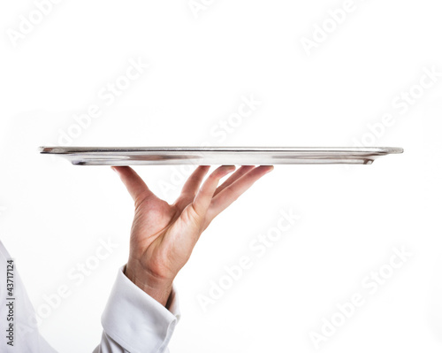 Hand holding an empty dish photo