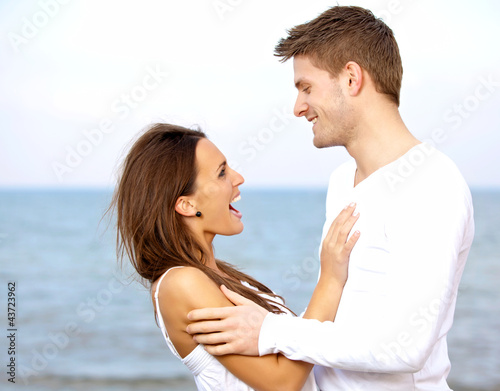 Couple Enjoying Each Other's Company at the Beach