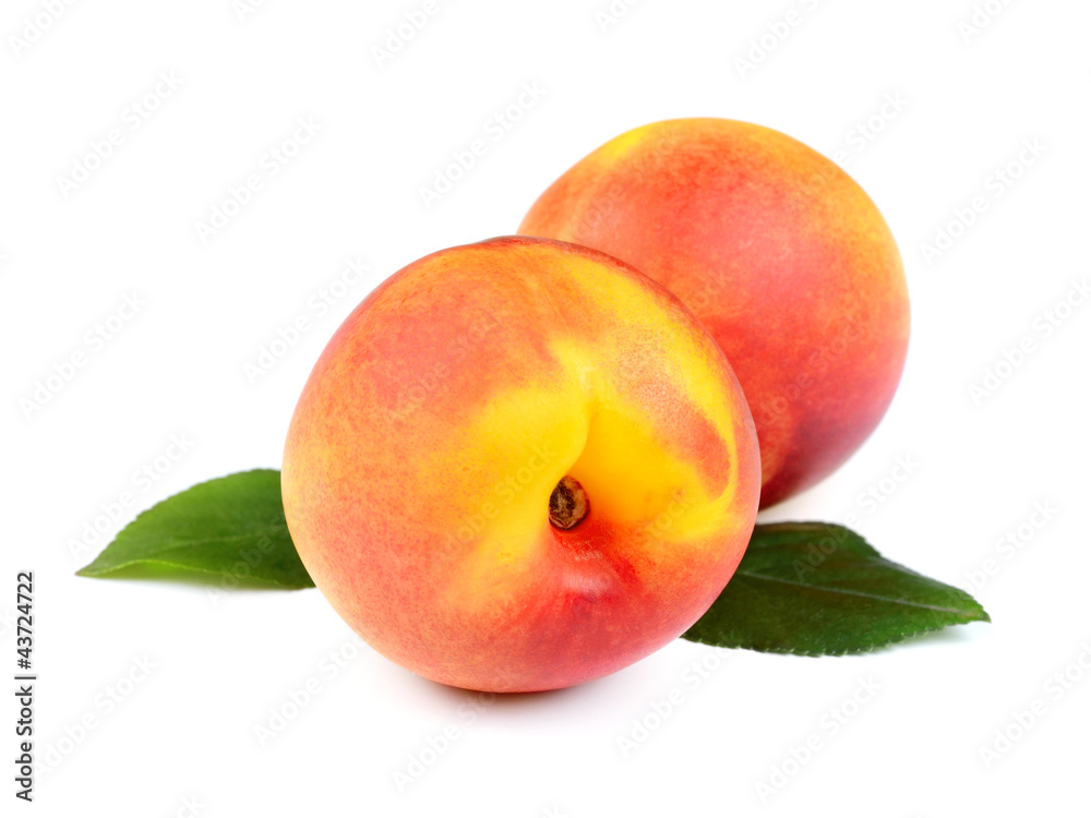 Fresh Peach Fruits with Green Leaves Isolated on White Fresh Peach Fruits with Green Leaves Isolated on White