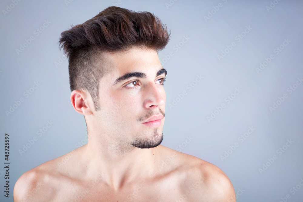 Young man profile with copyspace on grey background Young man profile with copyspace on grey background