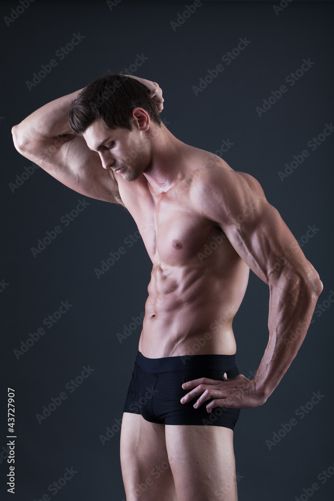 Fototapeta premium Portrait of a young sexy shirtless muscular man