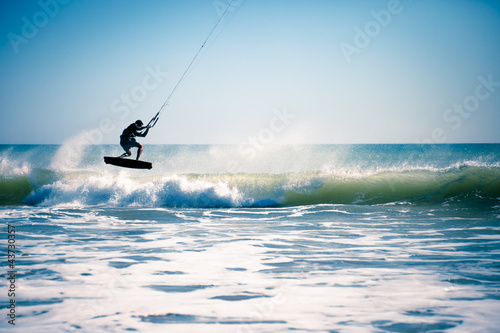 Kite surfing in waves.