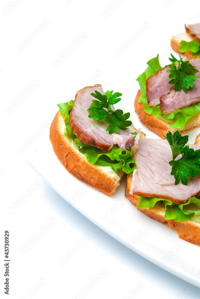 Closeup ham, salad and parsley canapes Closeup ham, salad and parsley canapes