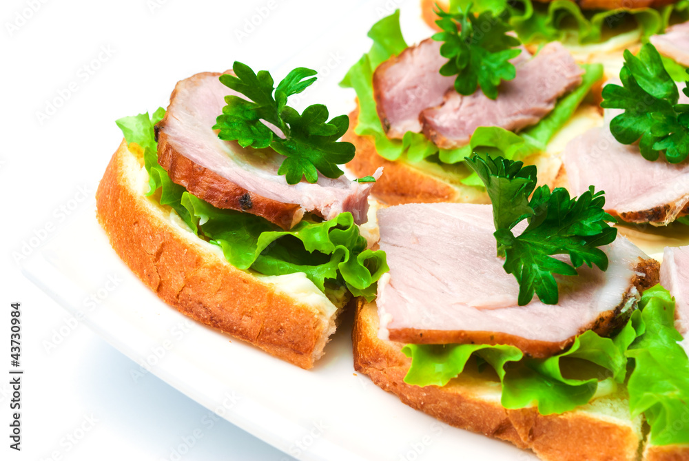 Closeup ham, salad and parsley canapes