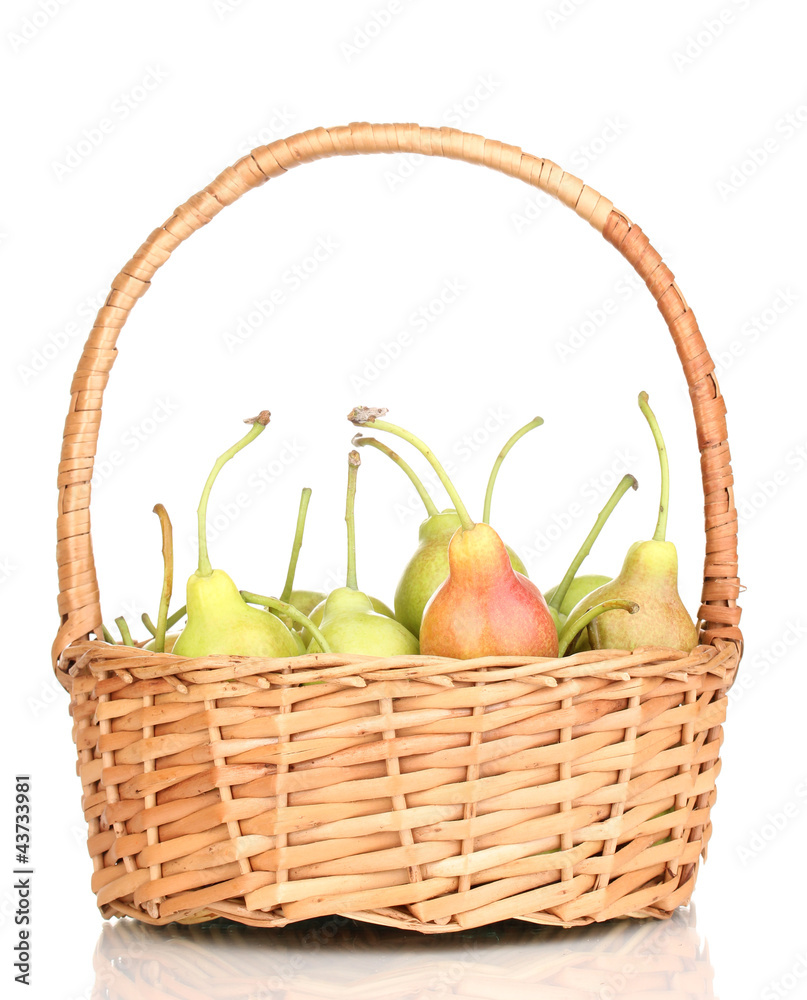 ripe pears in basket isolated on white.